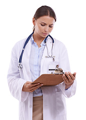 Image showing Woman, doctor and reading policy on clipboard for healthcare on a white studio background. Face of female person, surgeon or medical nurse looking at results, signup or life insurance in medicare