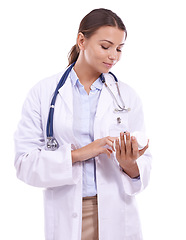 Image showing Woman, doctor and reading label of medication for pills, prescription or side effect on a white studio background. Female person, pharmacist or medical nurse checking dosage for healthcare results