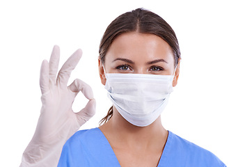 Image showing Happy woman, portrait and doctor with ok sign or face mask for good job on a white studio background. Young female person, surgeon or medical nurse with like emoji, yes gesture or perfect on mockup