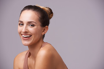 Image showing Skincare, happy and portrait of woman in a studio with health, wellness and dermatology routine. Cosmetic, confident and young female person with natural facial treatment isolated by gray background.