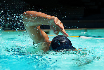 Image showing Pool, water splash and athlete swimming in sport for competition, race or training in cardio. Fitness, workout and person exercise for health, wellness or practice stroke or performance in gym