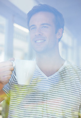 Image showing Man, coffee and thinking by window in home with smile, vision or idea with drink, choice and remember in morning. Person, tea cup and happy with view for memory, decision or relax on holiday in house