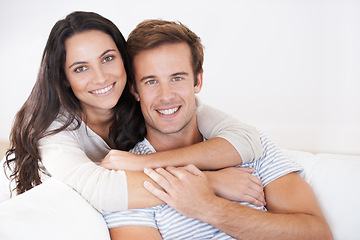 Image showing Portrait, couple hug and love, relax on sofa with trust, marriage and happy at home for healthy relationship. People bonding, loyalty and connection with smile, partner and romance together at house