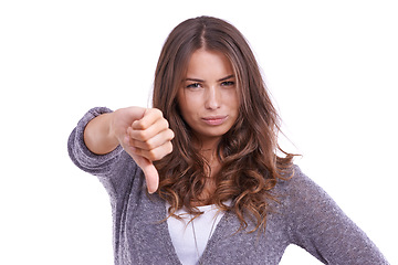 Image showing Thumbs down, portrait and hands of woman in studio for rejection of bad news, emoji sign and vote no for feedback on white background. Unhappy model show negative review, wrong decision and failure