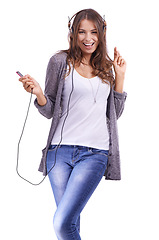 Image showing Happy woman, portrait and headphones listening to music or dancing on a white studio background. Face of young female person smile with radio or audio player for sound track, podcast or streaming