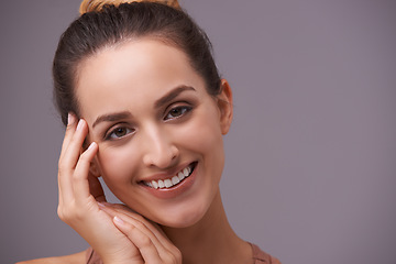 Image showing Portrait, smile and beauty with woman on space in studio for skincare, wellness or natural cosmetics. Face, aesthetic and mockup with happy young person on gray background for natural dermatology
