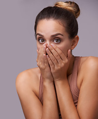 Image showing Woman, shocked and portrait with mouth closed, wow or secret with hands, gossip on studio background. Surprise, news and omg for rumor, announcement and information with face, confession or wtf