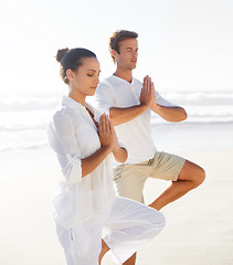 Image showing Beach yoga, balance and relax couple meditate for spiritual peace, self care and outdoor wellness for chakra healing. Freedom, pilates partner and yogi meditation for calm, zen mindset or mindfulness