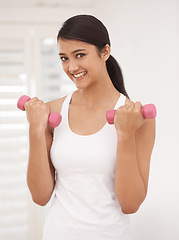 Image showing Woman, portrait and dumbbells for workout at gym, fitness and strong biceps or muscle growth. Happy female person, smiling and weights for exercise and training, equipment and tools for athlete