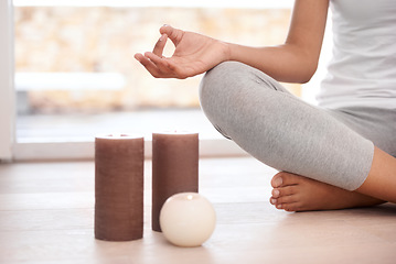 Image showing Woman, hands and meditation by candles for zen, exercise or yoga in spiritual wellness or inner peace at home. Closeup of calm female person or yogi meditating in relax for awareness or mental health