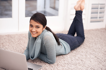 Image showing Portrait of woman on floor with laptop, smile and relax with studying, college research and browse on web. University student girl on carpet with computer, elearning and online education in home.