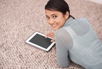 Image showing Happy woman, portrait and tablet on floor for research, communication or streaming at home. Young female person smile with technology in relax for online search, networking or social media on carpet