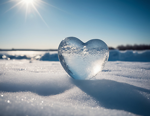 Image showing Piece of ice in the shape of a heart illuminated by rays of sunl