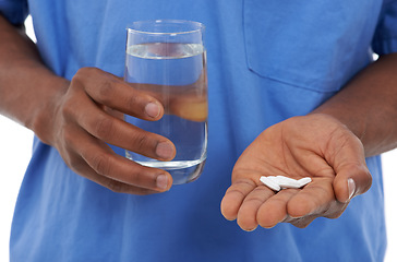 Image showing Hands, pills and water for medication, virus and disease with drugs, medicine or vitamins. Nurse, pharmaceutical and healthcare for treatment, medical and tablets for closeup or prescription