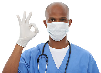 Image showing Face mask, perfect sign and portrait of doctor in a studio with glove and stethoscope for consultation. Virus, protection and African male healthcare worker with ok hand gesture by white background.