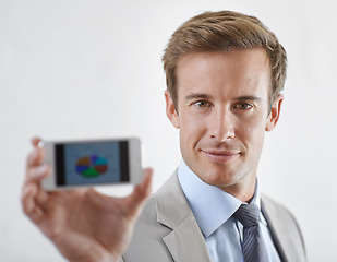 Image showing Business man, phone screen and statistics, pie chart or data for financial report, revenue and stock market. Portrait of corporate accountant on mobile for trading or sales on a white wall background