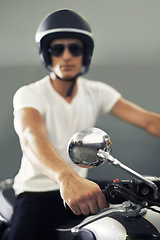 Image showing Portrait, man and motorcycle with handlebar, cool and travel with hobby, riding and safety with fun. Face, person and biker with a helmet, stylish or sunglasses with protection, trendy outfit or road
