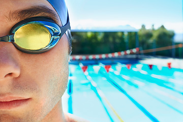 Image showing Swimming goggles, sports and portrait of man for pool exercise, outdoor workout or training practice. Commitment, poolside and face of waterpolo player for competition, fitness or cardio performance