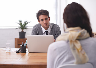 Image showing Coworkers, laptop and office with interview, conversation and technology in workplace. Man, woman and businesspeople with manager, team or recruitment with discussion, mentor and professional