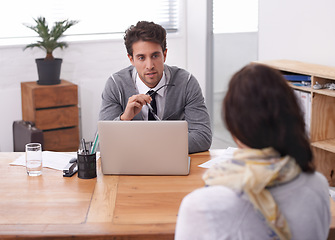 Image showing Coworkers, laptop and office with interview, discussion and technology in workplace. Man, woman and businesspeople with manager, hiring or recruitment with conversation and professional agency