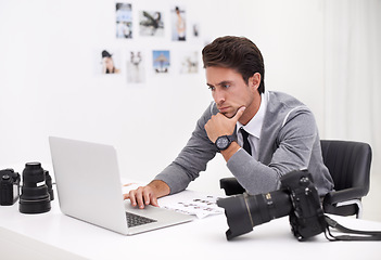 Image showing Photographer, thinking and editing on computer in office with technology, software and work. Professional, editor and creative person learning on laptop with photoshoot results or cinematography