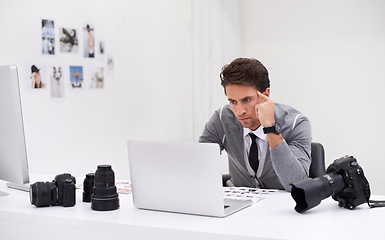 Image showing Photographer, working and editing on computer in office with technology, software and thinking. Professional, editor and creative person learning on laptop with photoshoot results or cinematography