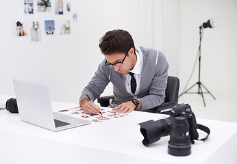 Image showing Writing, photography and man in office editing with production, process and technology. Professional, editor and creative person working on desk with photoshoot results, review or notes for magazine