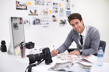 Image showing Man, camera and photography in agency with portrait, checking image design and creative in workplace. Person, smile face and glasses for vision, technology and focus in office with digital photoshoot