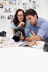 Image showing Camera, studio and photographers team editor in an office or workshop for production. Creative, photography and young artists with dslr equipment for editing pictures inspection in modern workplace.