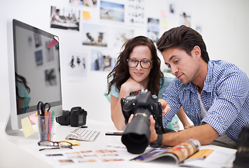 Image showing Man, woman or camera for workshop photography with teamwork, lens and creative editor in workplace. People, photographer and collaboration in career, technology or focus in office on digital graphic