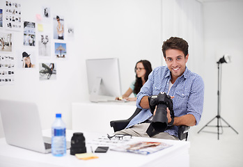 Image showing Man, camera and stock photography in portrait, checking image design and creative in workplace. Person, smile face or happy in production career, technology or focus in office with digital graphic