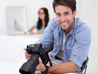 Image showing Man, photographer and portrait with camera, happy and lens for work, shoot and editing photographs. Professional, office and technology with creativity, internet and equipment for videography