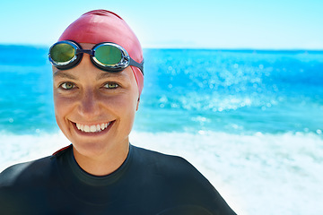 Image showing Swimmer, goggles and portrait of woman at ocean outdoor in summer for exercise, training or workout on mockup space. Sea, face or sport athlete in nature for fitness, health or triathlon at the beach