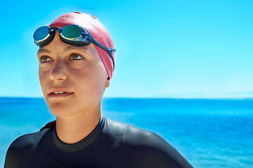 Image showing Swimmer, water and woman at ocean outdoor in summer for exercise, training or workout on mockup space. Sea, sport athlete or person in goggles in nature for fitness, health or triathlon at the beach