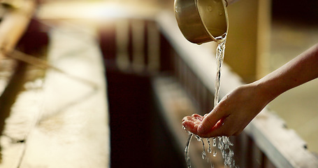 Image showing Shinto temple, closeup and washing hands with water in container for cleaning, faith and wellness. Religion, mindfulness and purification ritual to stop evil, bacteria and peace at shrine in Tokyo