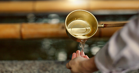 Image showing Temple, closeup and person washing hands in water, container and clean with faith for wellness. Religion, mindfulness and Shinto purification ritual to stop evil, bacteria or peace at shrine in Tokyo