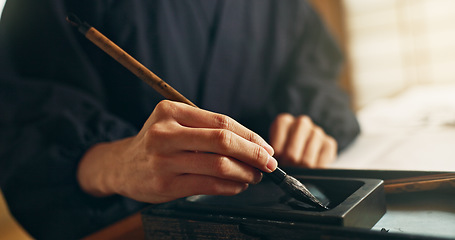 Image showing Hands, reed pen or brush in ink for writing, calligraphy or ancient script for art and inkstone. Japanese creativity, black paint and vintage tools, paintbrush and stroke, traditional and stationery