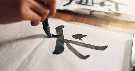 Image showing Hands, brush for writing and ancient font for art and script, calligraphy and closeup with alphabet. Japanese, creativity and vintage tools, paintbrush and person stroke with traditional stationery