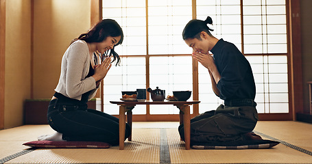 Image showing Couple, bow for hello and eating food, Asian people on date with respect, culture and love together in Japan. Hungry for Japanese cuisine, trust with commitment and greeting for religion and care