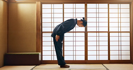 Image showing Bow, taekwondo or Asian man in dojo for martial arts for fitness, discipline or self defense for respect or honor. Kung fu master, workout or person in training for fighting, karate or combat sports