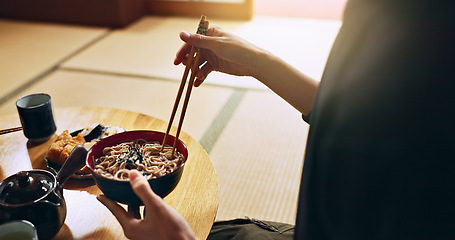 Image showing Closeup of bowl of noodles, hands and man is eating food, nutrition and sushi with chopsticks in Japan. Hungry for Japanese cuisine, soup and Asian culture with traditional meal for lunch or dinner