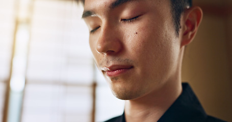 Image showing Thinking, calm and young Asian man with meditation, zen and relaxing face expression at home. Idea, mindfulness and male person with memory, reflection and breathing exercise in modern apartment.