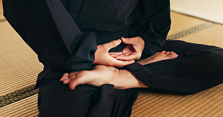 Image showing Martial arts person, meditation and floor with hands, feet and peace in dojo with spiritual guide for fight. Yoga, chakra balance and zen exercise for peace, calm or breathe for mma, karate or health