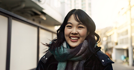 Image showing Happy, laughing and face of Asian woman in the city on vacation, adventure or weekend trip. Smile, travel and portrait of excited young female person with positive attitude in urban town on holiday.