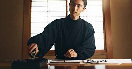 Image showing Paper, ink and traditional Asian man for writing letters, notes and text for documents or script. Creative writer, culture and person with paint, tools and desk for art, calligraphy and handwriting