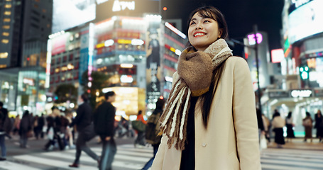 Image showing Night, walking and young woman in the town for exploring on vacation, adventure or holiday. Happy, travel and beautiful Asian female person by public transport for sightseeing on weekend trip in city