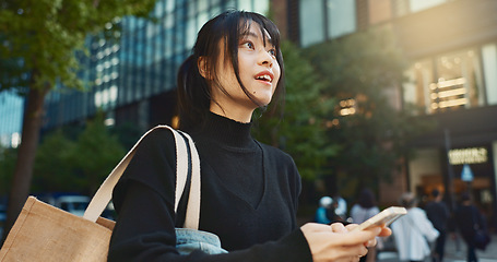Image showing Japanese woman, phone and direction in city with smile, walking or thinking with map by buildings. Person, pedestrian and smartphone with location, schedule or information for address on metro street