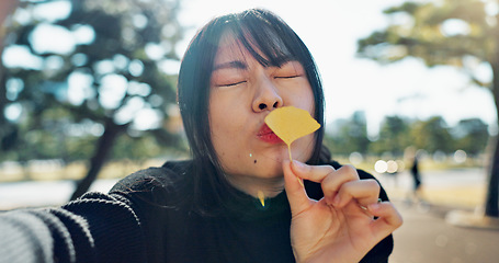 Image showing Japanese woman, face and selfie in park for happiness in city, spring and sunshine in outdoor. Young person, smile and portrait with flower for fun, crazy and gen z in urban town for travel leisure