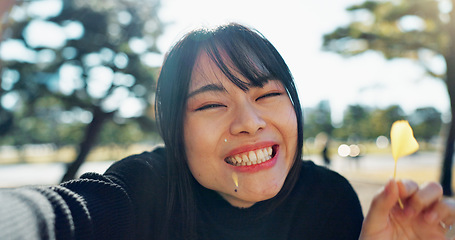 Image showing Asian, happy woman in park and leaf with face and explore nature for wellness and outdoor environment. Sunshine, plants and portrait, travel and adventure in public garden with smile on journey
