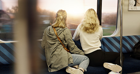 Image showing Women, back view and train window with travel, journey with commute or tourism, transportation and sightseeing. Friends are together, traveller and adventure with trip, public transport and metro